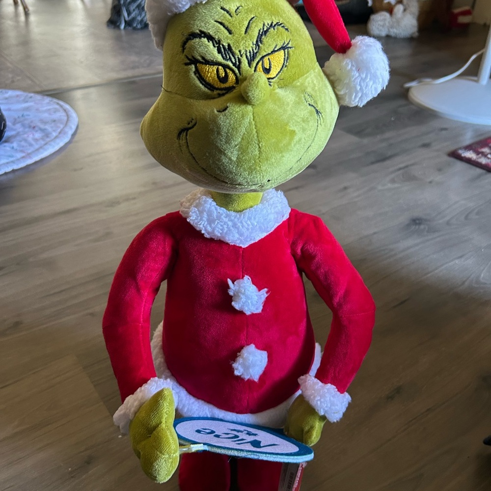 Festive Red and White Grinch Decoration. Stands 2 feet tall with tag